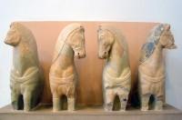 Akr 575-576. 678-580. 320. Foreparts of four horses from a chariot group (Frontal View)