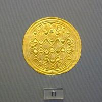 11. Gold roundels with repoussé motifs