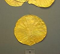 8. Gold roundels with repoussé motifs