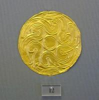 12. Gold roundels with repoussé motifs