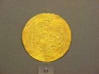 13. Gold roundels with repoussé motifs