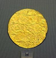 14. Gold roundels with repoussé motifs