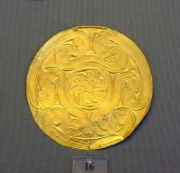 16. Gold roundels with repoussé motifs