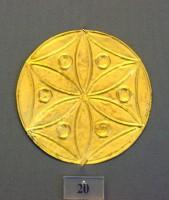 20. Gold roundels with repoussé motifs