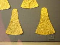 22. Triangular gold cut-outs with repoussé spirals for the adornment of rich garments.