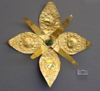 15. Gold floral ornaments of overlapping sheets, perhaps the heads of elaborate pins.
