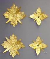 15, 25. Gold floral ornaments of overlapping sheets, perhaps the heads of elaborate pins.