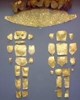 146. A unique gold covering for the body and the face of an infant, consisting of pieces of gold foil.