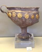 122. Silver goblet with applied gold rosettes on the body.