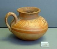 156. Elegant clay alabastron decorated with foliate bands inside circles.