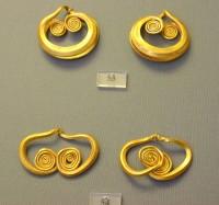 53, 54. Gold earrings made of thick wire ending in spirals. 