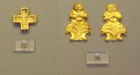 36, 52. Gold cut-outs in the shape of a female figure and of a cross.