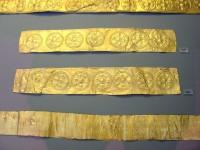 255-256. Gold belts or sword straps with repoussé rosettes and circles. Grave IV.