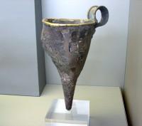 481. Silver conical rhyton, known as the 'Siege Rhyton' because of its unique representation of a besieged walled settlement. Grave IV.