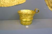 629. Gold cup with rich spiral decoration.