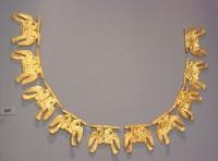 689. Gold necklace consisting of ten foils, each shaped like a pair of antithetic eagles - a symbol of power.