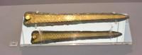 744. Bronze dagger with inlaid decoration.