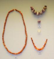 110, 111, 114. Necklace beads made of cornelian and amethyst. Graves III and IV.