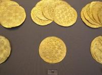 11. Gold roundels with repoussé motifs