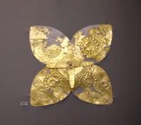 88. Gold floral ornaments of overlapping sheets, perhaps the head of elaborate pins.