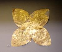 87. Gold floral ornaments of overlapping sheets, perhaps the head of elaborate pins.