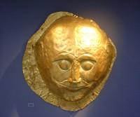 259. Gold male death-mask made of sheet metal with repoussé details. The only one with the eyes open.