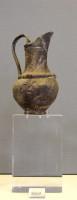 8569. Silver jug, originally covered with a piece of cloth. Grave A