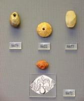 8679, 8622, 8677, 8672. Beads made of semi-precious stones (sard, rock-crystal, 8679, 8677-Grave Upsilon), Amber bead (8622-Grave Iota), Sard stone seal with vase and palm-tree representation (8672-Grave Mu)