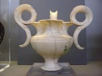 389.  Marble ritual vase with elaborate handles and a small pouring hole at the base. Grave IV.