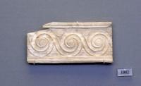 1002. Ivory inlay plaque decorated with relief spirals.