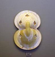 1027. Ivory figure-of-eight shield.