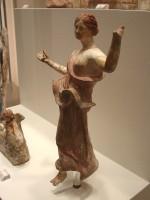 Gods in Color: 3. Clay figurine of Victory (Nike), holding a sea-shell. Myrina. 150-130 B.C. (no. 5101)