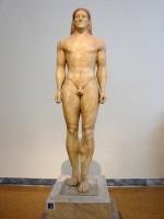 3851. Statue of a kouros. Parian marble. Found in Anavyssos, Attica. It had been stolen and taken to France, from where it was returned in 1937. The body is powerful and articulate, with emphasized musculature.
