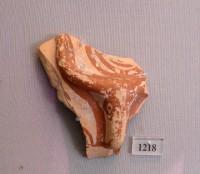 1218. Fragment bearing a plastic bovine head