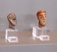 1219, 2595. Heads of  female and male figurines