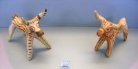 2658. Stylized clay figurines of bulls and possibly a horse.
