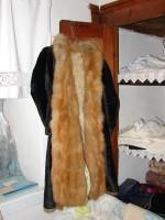 Delinaneio Folklore Museum: Woman's furcoat hanging at the wardrobe