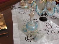 Delinaneio Folklore Museum: Old glass-ware on hand-made embroidery