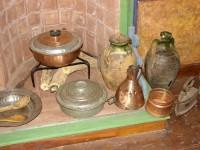 Dolgiras Mansion: Vintage Bronze-ware resting in the hearth of the fire-place
