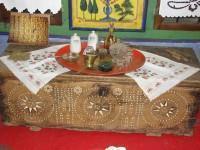 Dolgiras Mansion: Traditional wooden hope chest and tray with glassware on it