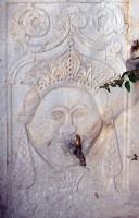 Mykonos, Ano Mera, The Holy Monastery of Our Lady Tourliani: The 'Emperor's Head' (?) carved on the Marble Fountain