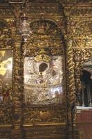 Η Ιερά Μονή της Παναγιάς της Τουρλιανής, στην Άνω Μερά: Στα δεξιά της Ωραίας Πύλης (αριστερά όπως βλέπουμε το Τέμπλο), καλυμμένη με ασήμι και χρυσό και αργυρά αφιερώματα