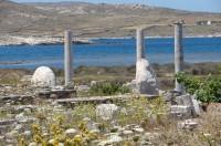 Delos Archaeological Site: Another photo of the remaining parts of the Colossus as they are today in front of the Artemesion, taken with the photographer standing east of Pythion (Nr 19) and Artemesion (Nr 22)