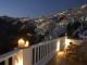 Athina Repose Suites: View of Fira from pool-terrace at night