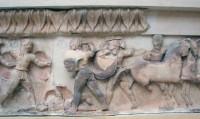 East side of the frieze of the Siphnian treasury (525 BC.). Greeks and Trojans fighting over a dead hero. (Detail)