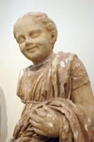 Marble statue of a smiling girl